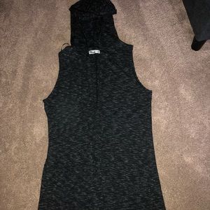 A long, dark grey sweater vest